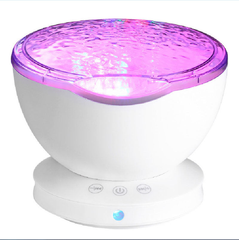 Aurora ocean wave projector night light glowing pink, front view