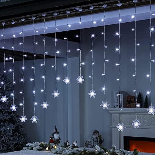 Snowflake LED curtain lights hanging across a window