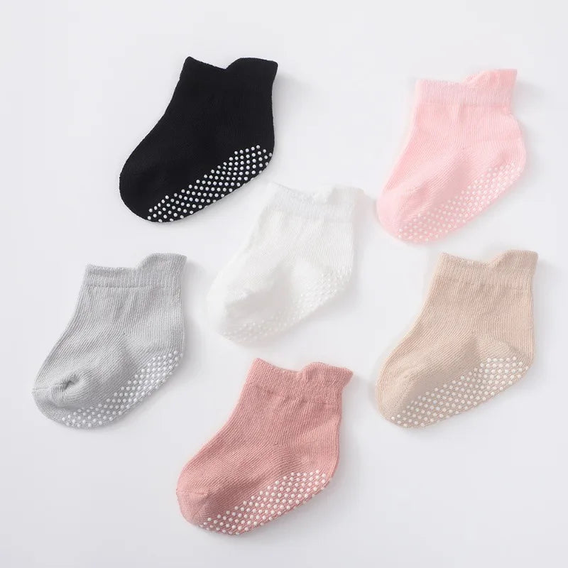 Non-slip baby grip socks, six pairs laid flat
