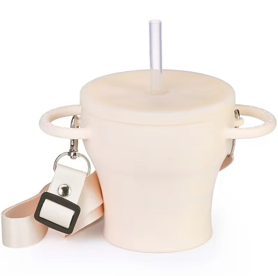 Collapsible silicone snack cup with straw lid, side view