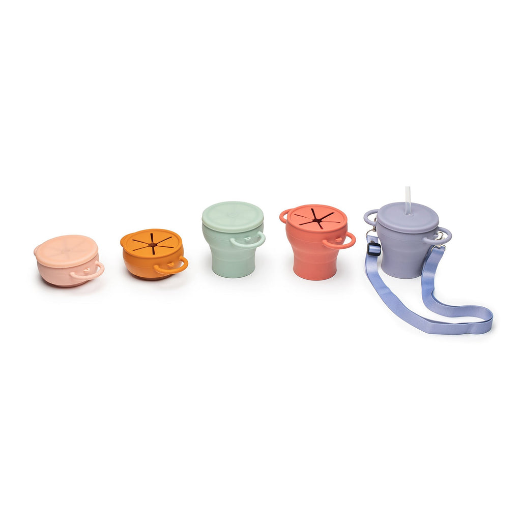 Collapsible silicone snack cups in several colours, shown expanded and folded flat