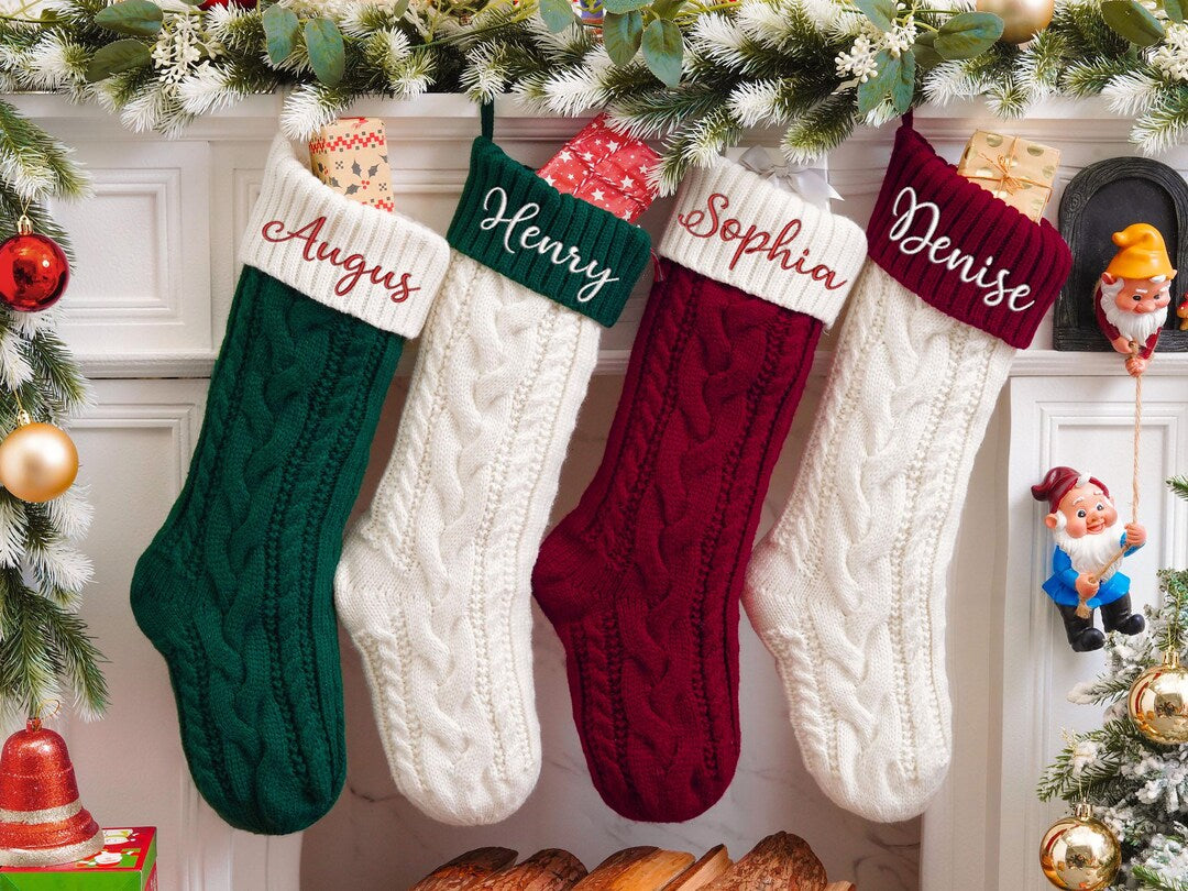 Knitted family Christmas stockings hanging for the holidays