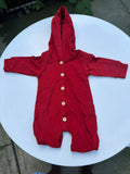 Red hooded baby romper with wooden-look buttons, long sleeves