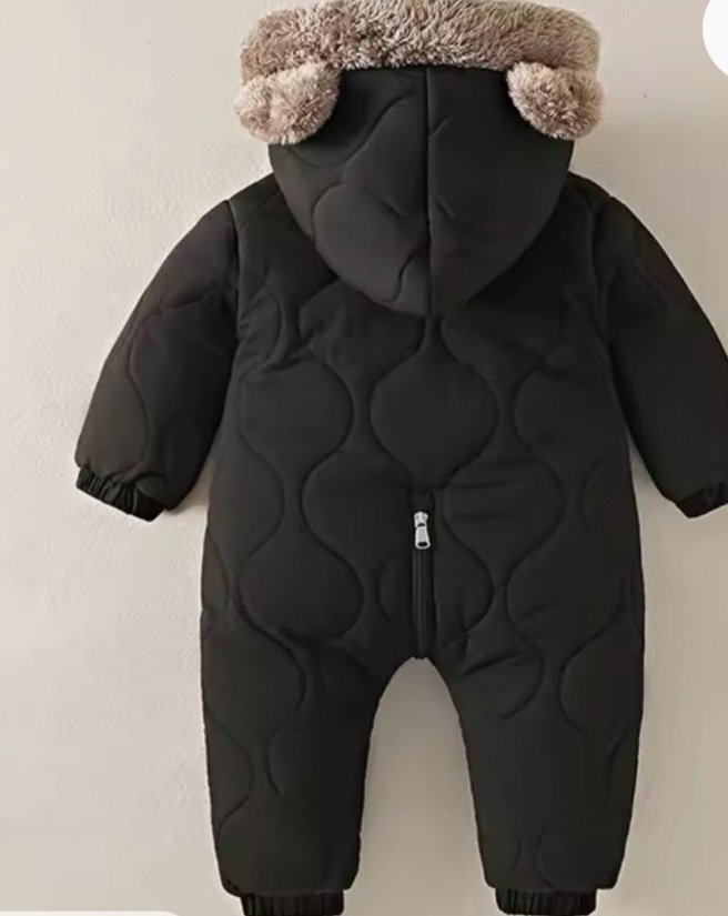 Black quilted baby snowsuit romper with fur-trim hood, back view